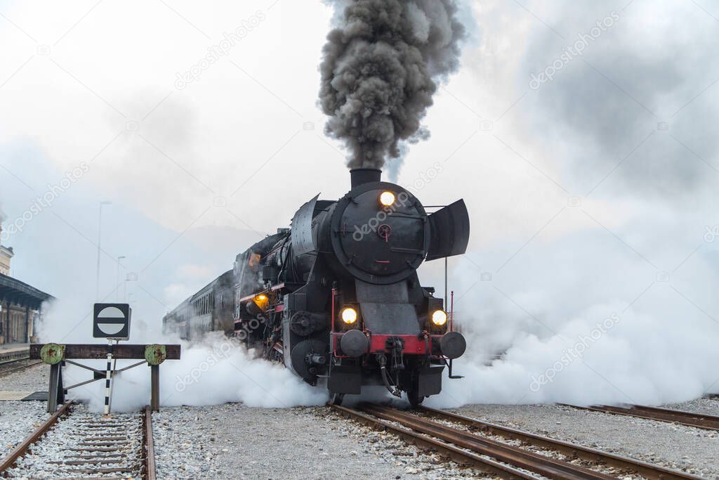 Old Steam train - locomotive is leaving the Railway Station at Nova Gorica, Slovenia, Europe