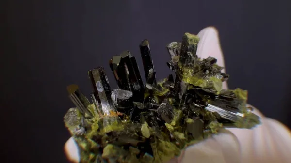 Vesuvianus is a macromineral crystal stone on a black background