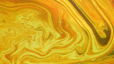 Sarı mavi turuncu. Renkler sıvıya batırıldı ve hareket halinde fotoğraflandı. soyut kompozisyon.