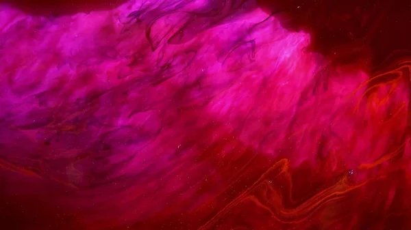Abstrakcyjna Eksplozja Różowego Tuszu Czerwonym Tle Abstrakcyjny Różowy Brokat Hipnotyzujący — Zdjęcie stockowe