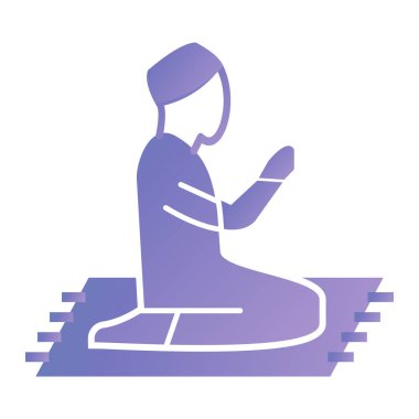 Elinde kitapla yerde oturan bir adam.