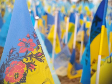 Flags of Ukraine close-up. A symbol of the independence of the Ukrainian people. Action in support of Ukraine