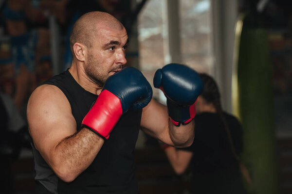 Training of athletes boxers in the gym
