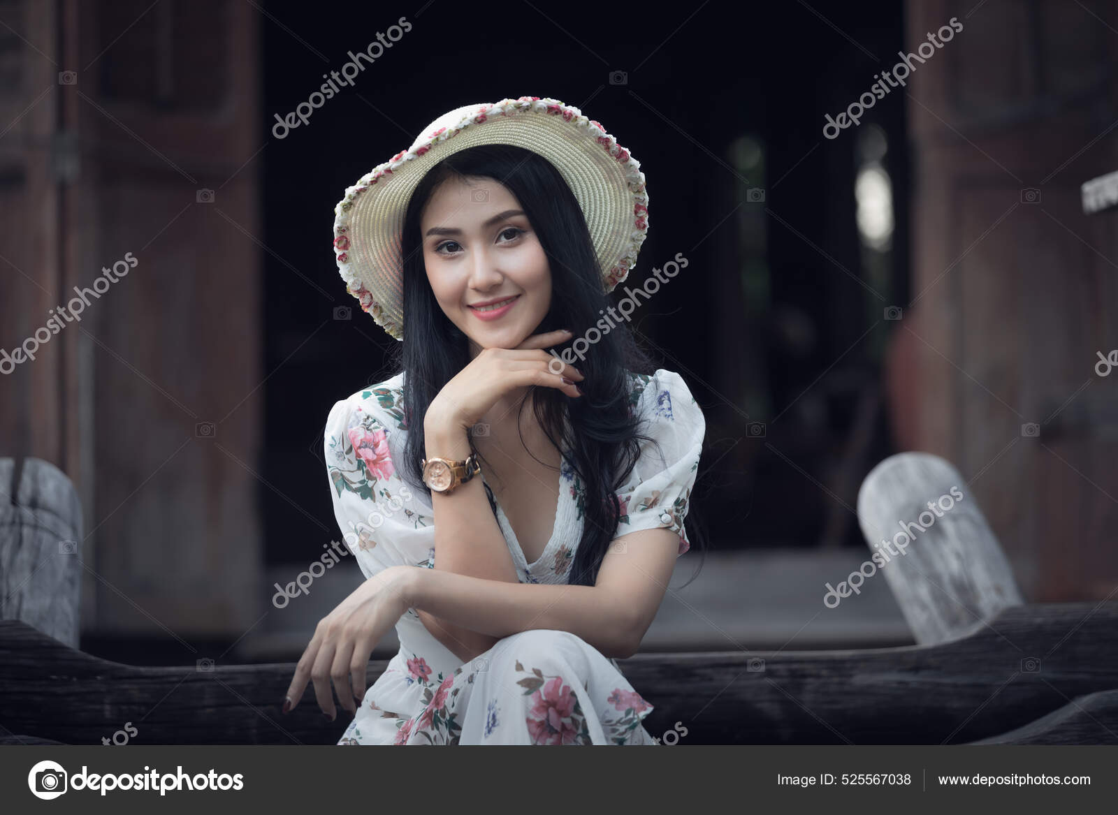 Beauty shot of black long hair Asian woman focus on blue eye in the dark  bed room natural window light. Stock Photo
