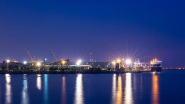 night scene shot shipping port and factory area 
