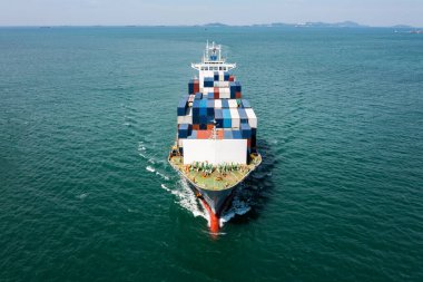 aerial view head container ship full speed floating in green sea, business and industry Transportation cargo logistics services of international by container ship in ocean, global business Transportation Worldwide connections 