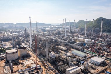 Oil refinery plant industry zone, Aerial view oil and gas petrochemical industrial, Refinery factory oil storage tank and pipeline steel photograph from drone of point view 