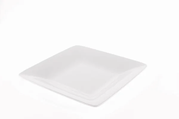 白色背景的白色陶瓷制成的食物调色板 — 图库照片