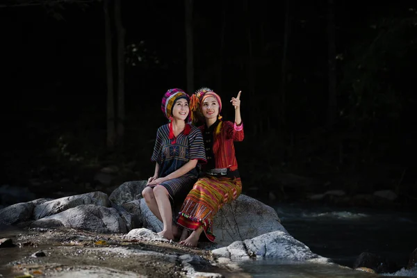 Two Young Karen Girls Smiled Sit Rock Middle Forest — Stockfoto