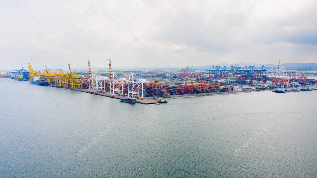 transport dock and container warehouse and shipping loading and unloading cargo containers import export international by the sea aerial view