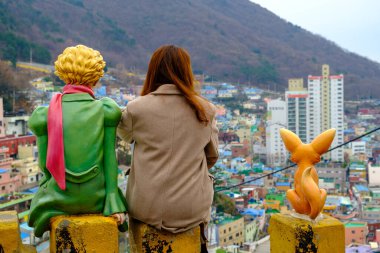 Busan city, South Korea - December 29, 2019: People photo with Little Prince statues in Gamcheon Culture Village Busan city of South Korea clipart