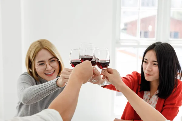young asian people cheering red wine enjoy party in office, business people party celebration success Concept