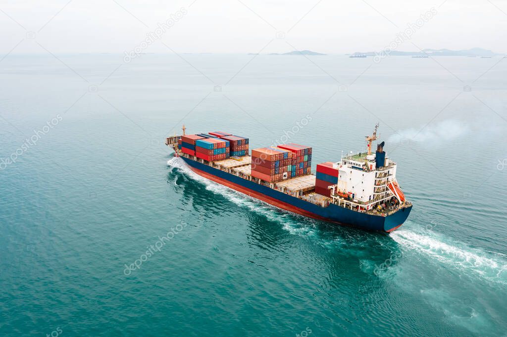 Container ship full speed sailing in sea for transporting cargo logistic import and export goods internationally around the world, including Asia Pacific and Europe, Aerial view photograp from drone 