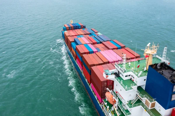 aerial back view of container ship carrying cargo container import export internatioonal and worldwide, business and industry goods logistic transportation by container ship in open sea, shipping cargo container concept,