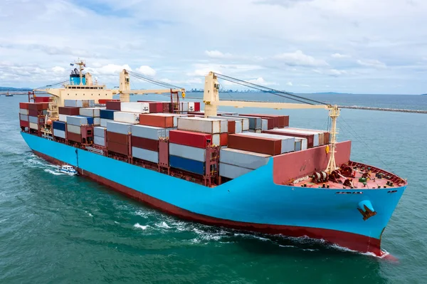 aerial front view container ship carrying cargo container import export internatioonal and worldwide, business and industry goods logistic transportation by container ship in open sea, shipping cargo container concept,