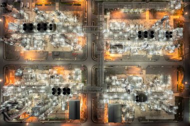 Aerial top view of night oil and gas refinery and factory Petrochemical plant photograph from drone 