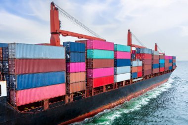 rear view of container ship logistics goods transportation import and export International by container cargo ship in the ocean, global business and industry service transportation of good by sea concept,