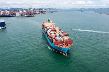 front view of container ship logistics goods transportation import export International by container cargo ship in the ocean, global business and industry service transportation of goods by sea concept,