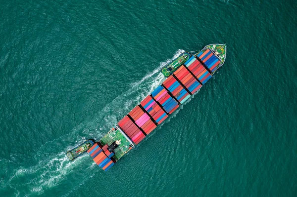 aerial top view container ship carrying cargo container import export internatioonal and worldwide, business and industry goods logistic transportation by container ship in open sea, shipping cargo container concept,