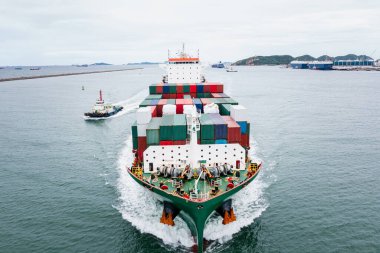 front view of container ship logistics goods transportation import export International by container cargo ship in the ocean, global business and industry service transportation of goods by sea concept,