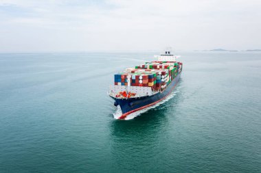 cargo container ship sailing in sea import and export business and industry logistic goods transportation of international by container ship in ocean fright aerial view photograph from drone 