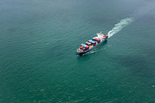 container ship to import export marine goods to dealers and consumers across the pacific and around the world, businesses and industries Ocean freight forwarding, aerial view