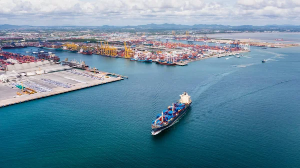 Container ship transporting cargo logistic import export goods internationally around the world, distribution to dealer and customer, business and industry delivery service logistic transportation by container ship in open sea, Aerial view