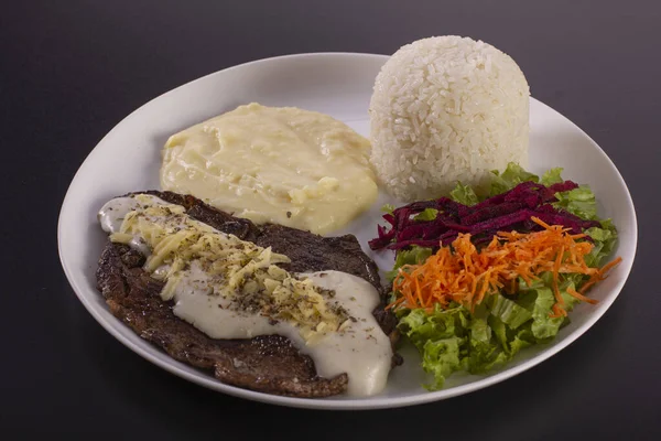 Brazilian food dish on a photographic background