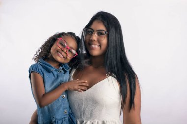 Young mother with daughter in photo studio on white background for clipping