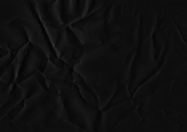 Crumpled paper texture. Crumpled black paper texture background. High resolution texture. Crumpled black paper.