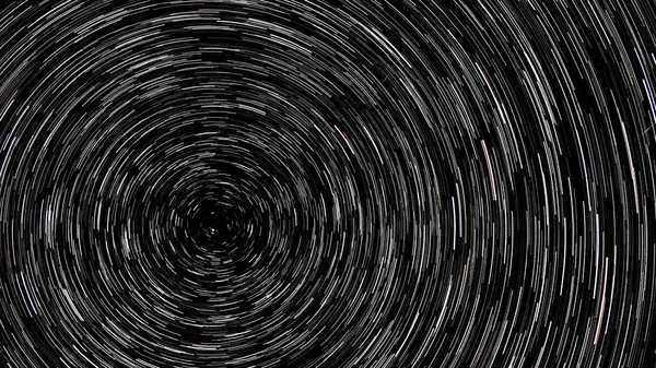 Startrails. Black and white star tails on the sky. Circular startrails. Startrails background. Polar star shot on long exposure.