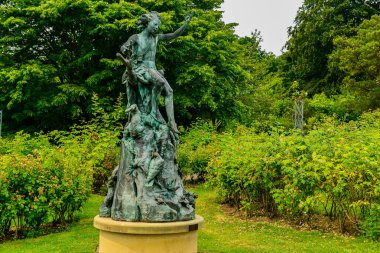 green stone statue in the park