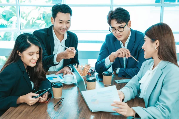 Happy diverse employees team celebrating teamwork success, business achievement at meeting. Group of successful happy business people working as a team in office on meeting.