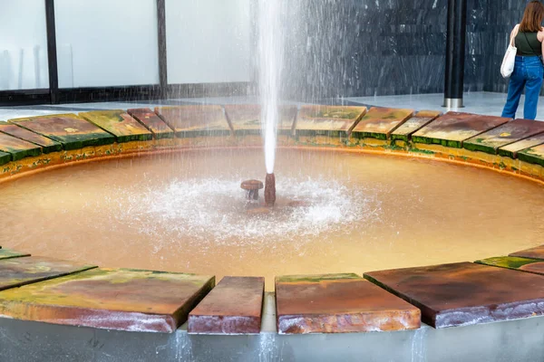 Karlovy Vary, Bohemia, Czech Republic - August 6, 2022, The Fontana Vridlo Sprudel or Vridlo Fountain in the colonnade of the hot spring or Vridelni Kolonada in Karlovy Vary.