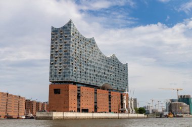 Hamburg, Germany - July 25, 2022, View of the Elbe Philharmonic Hall, Elbphilharmonie, a concert hall in Hamburg's Hafencity district and the River Elbe. The Westin Hamburg Hotel.