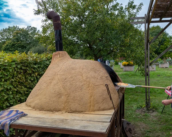 Outdoor pizza oven for baking bread and pizza. Traditional outdoor cooking