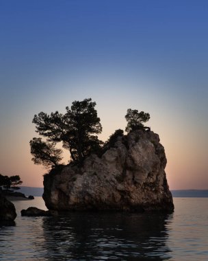Relaxing and romantic beautiful summer dawn with  and idyllic sunlight at adriatic sea in Dalmatia.