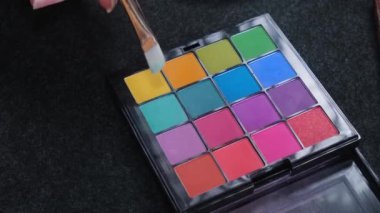 Eye shadow palette close-up and makeup brush. Close up shot. High quality 4k footage.