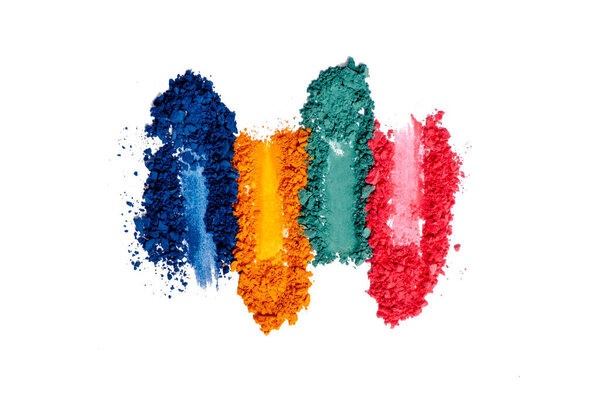 Flat lay of Broken bright multicolor eyeshadow as samples and swatches of cosmetic beauty product isolated on white background.