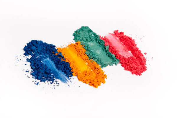 Flat lay of Broken bright multicolor eyeshadow as samples and swatches of cosmetic beauty product isolated on white background.