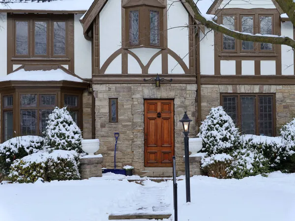 front door of Tudor style house in winter