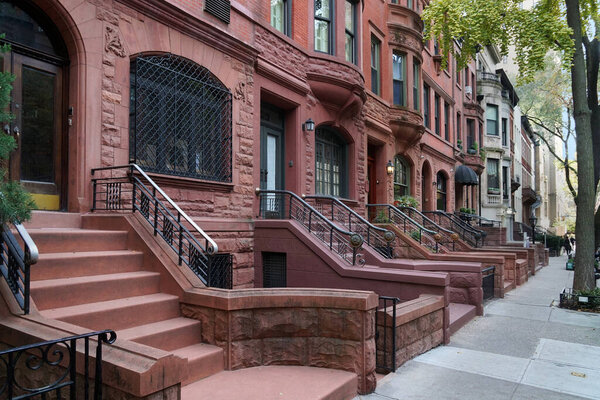 Residential street with old brownstone type townhouses