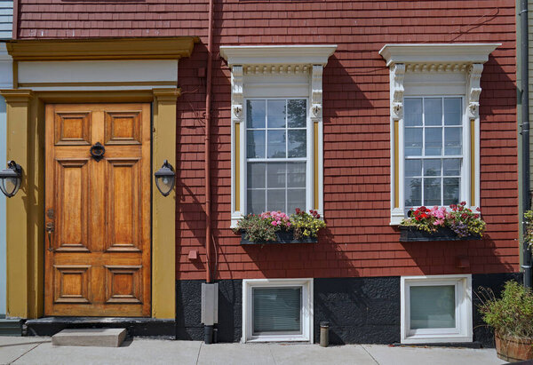 Front door and windows of old clapboard house