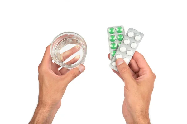 Mannelijke Handen Houden Borden Van Witte Groene Pillen Een Glas — Stockfoto