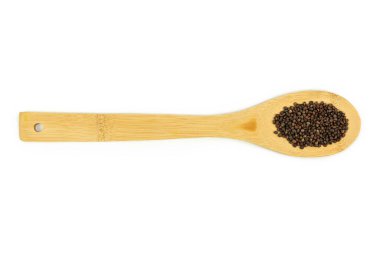 Broccoli seeds on wooden spatula isolated on white background, microgreens. The concept of growing greens at home. Top view