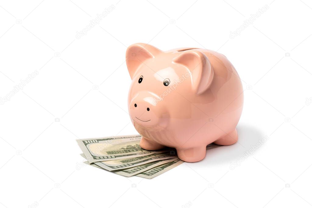 Pink piggy bank for money with paper dollar bills isorized on a white background. Financial savings and pension concept. Side view