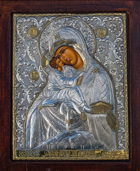 traditional orthodox icon of Mother Mary, Icon of Madonna,  Jesus, church faith concept, prayer, of Holy Mary of Magdalene, bizantine, gold background, Greece. wood table