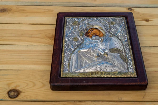 traditional orthodox icon of Mother Mary, Icon of Madonna,  Jesus, church faith concept, prayer, of Holy Mary of Magdalene, bizantine, gold background, Greece. wood table