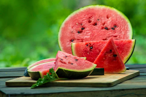 Delicious Watermelon Outdoors Wooden Table Green Natural Background Slice Sunny — ストック写真