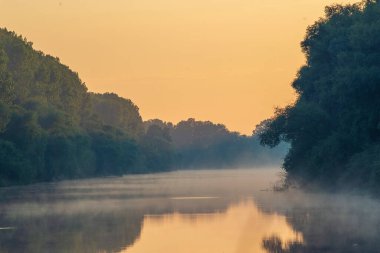 Early morning river.  fog trees. sunlight mist  water. Olanesti Moldova Dniester river reflection, beautiful   summer landscape sunrise quiet fishing spot forest